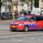 Rookwolk boven Aalsmeer zichtbaar in Amsterdam